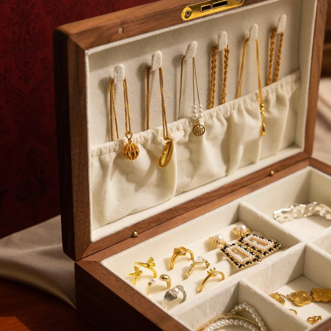 Close-up of magnetic closure mechanism and security lock with key on premium walnut jewelry box